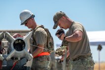 U.S. Air Force Airmen assigned to the 301st Munitions Squadron participate in Operation Mac-Attack as part of the Air Force Combat Operations Competition (AFCOCOMP) at Beale Air Force Base, California, Aug. 14, 2025.