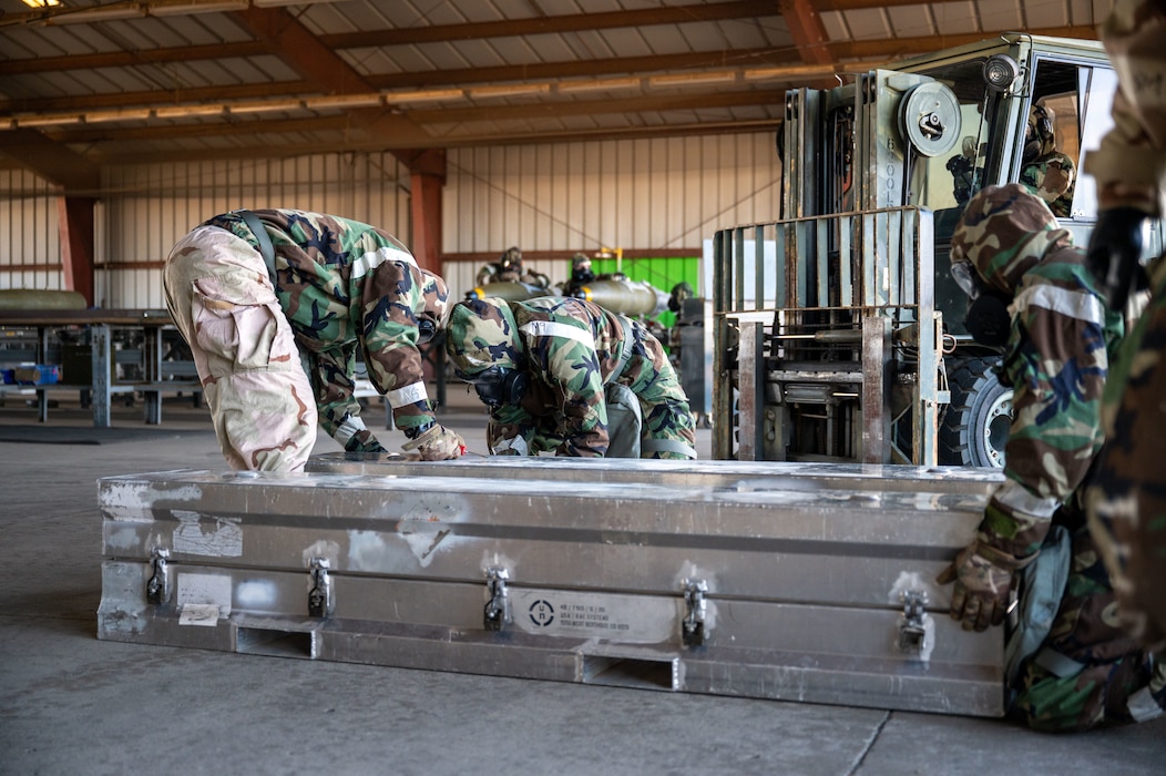 U.S. Air Force Airmen assigned to the 48th Munitions Squadron participate in Operation Exterminator as part of the Air Force Combat Operations Competition (AFCOCOMP) at Beale Air Force Base, California, Aug. 15, 2025.