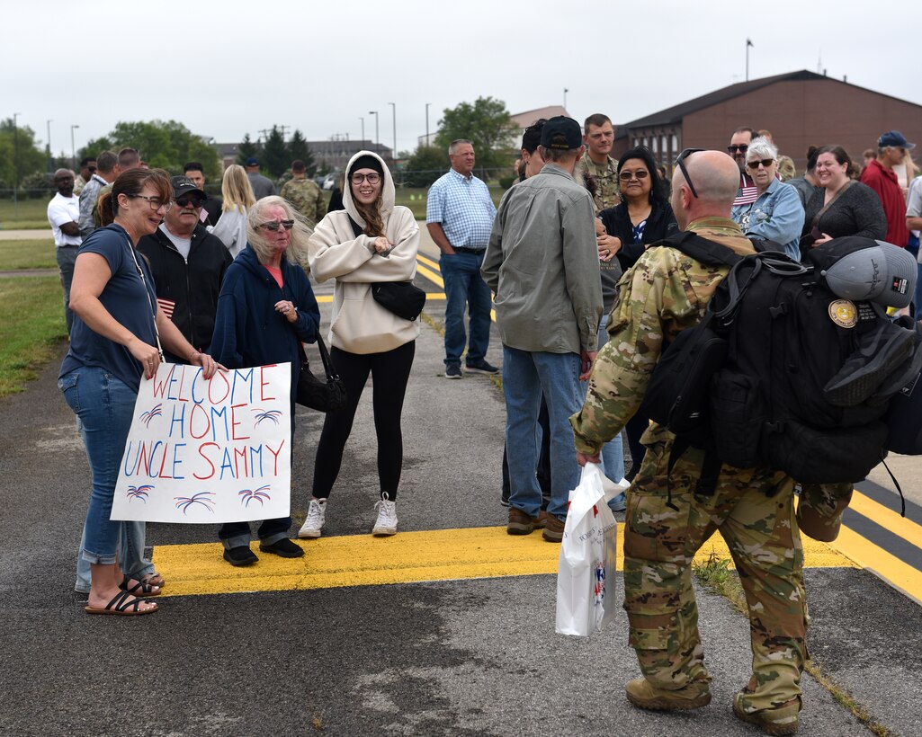 Friends and family welcome home members of the 914th Air Refueling Wing, Aug. 20, 2025, at the Niagara Falls Air Reserve Station, New York, following a four-month deployment overseas supporting global operations.