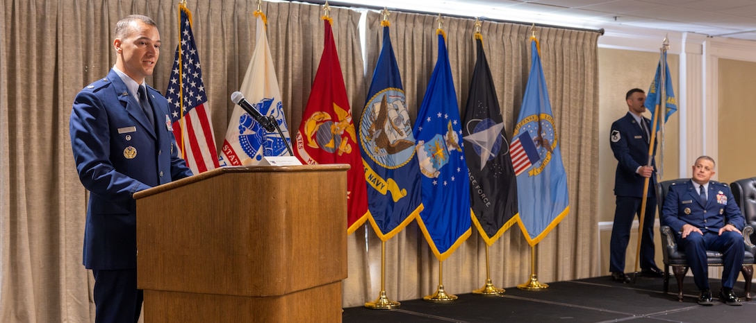 A lieutenant colonel speaks at a podium
