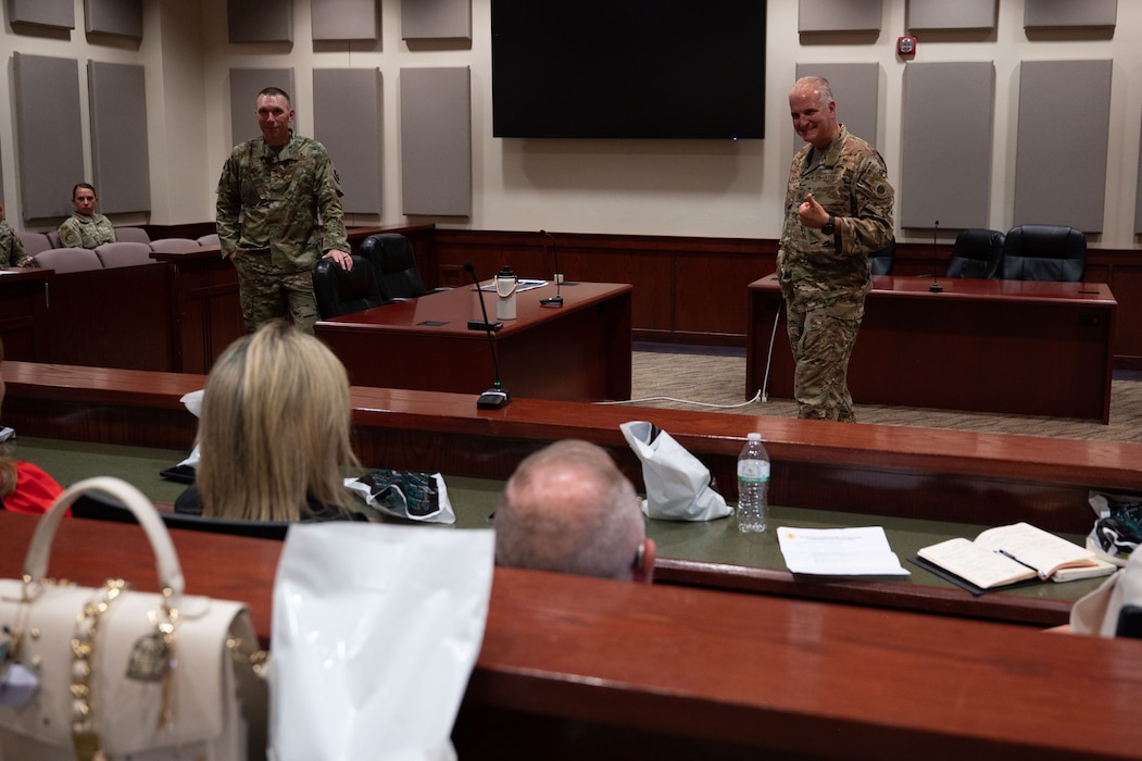 U.S. Air Force Col. Matthew Norton, 17th Training Wing commander, and Chief Master Sgt. Derek Neill, 17th TRW command chief, brief honorary commanders during the Wing Staff Agency immersion at the judge advocate court room inside the Norma Brown building, Goodfellow Air Force Base, Texas, Aug. 21, 2025. Norton and Neill discussed how the 17th TRW plans to reinforce Airmen lethality and warfighting capabilities. (U.S. Air Force photo by Airman 1st Class Brian Lummus)