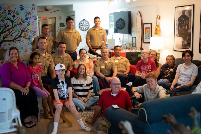 U.S. Marines with Special Purpose Marine-Air Ground Task Force-250, volunteers, and residents, pose for a photo at Christopher’s Haven, a temporary home for families and children receiving cancer treatment, during Marine Week Boston, Aug. 21, 2025. Marine Week Boston provides an opportunity for the Marine Corps to celebrate its 250th Birthday and connect with the community to show support while Christopher's Haven provides a supportive community of temporary apartments for families of children undergoing cancer treatment at nearby hospitals. (U.S. Marine Corps photo by Cpl. Vincent Needham)