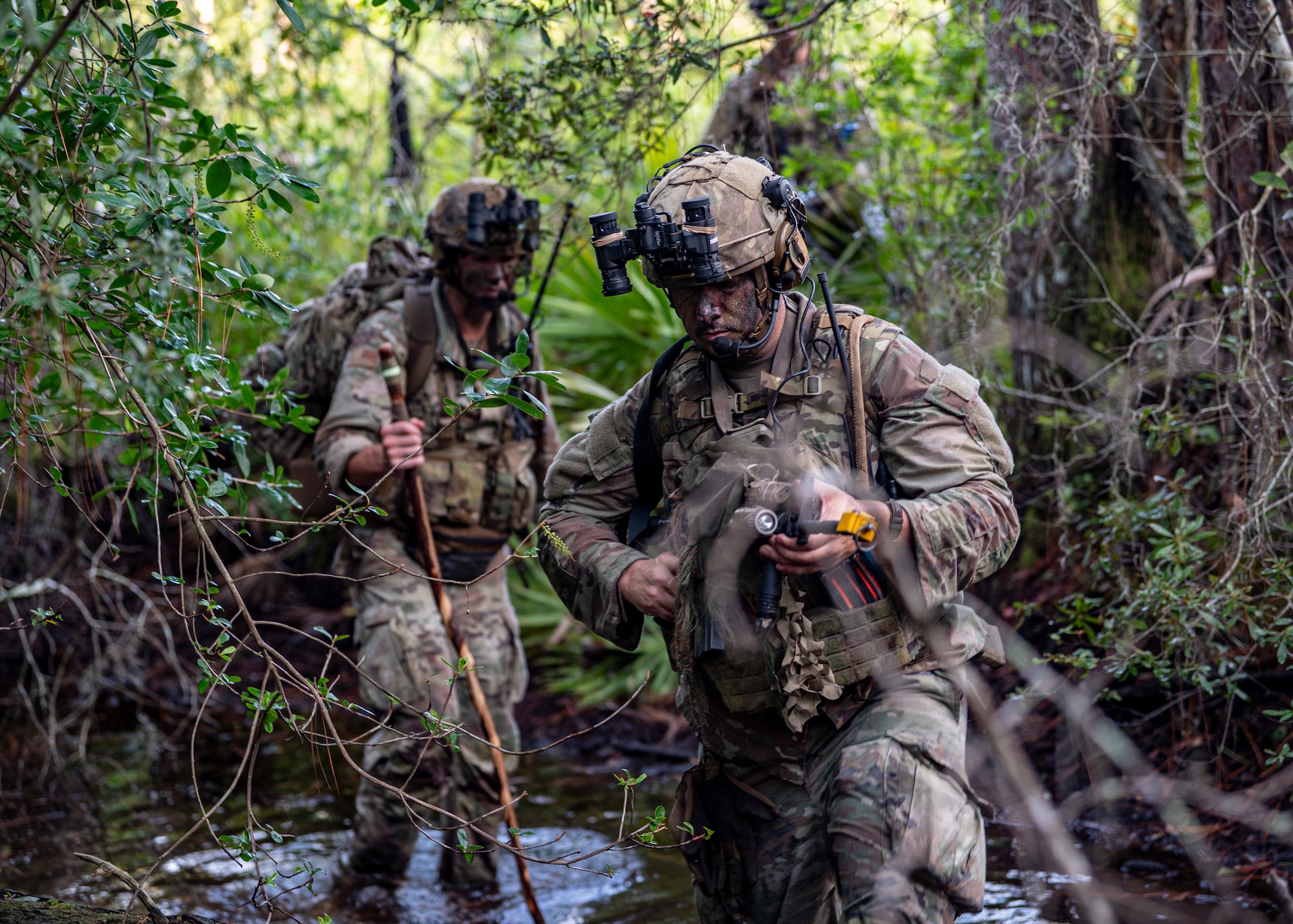 U.S. Air Force Airmen assigned to the 820th Base Defense Group ford water at Moody Air Force Base, Georgia, Aug. 5, 2025. The patrol enabled Airmen to exercise teamwork, navigation and combat skills in austere conditions. (U.S. Air Force photo by Senior Airman Leonid Soubbotine)