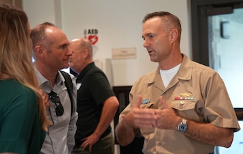 HONOLULU (Aug.20, 2025) Rear Adm. Marc Williams, deputy commander, Navy Closure Task Force-Red Hill (NCTF-RH), speaks with a guest during the NCTF-RH quarterly open house at the Oahu Veterans Center in Honolulu, Aug. 20, 2025. The quarterly open house focused on tank cleaning operations, Tank Closure Plan Supplement 4, environmental remediation and monitoring, and reactivation of the Navy Aiea-Halawa Shaft. Charged with the safe decommissioning of the Red Hill Bulk Fuel Storage Facility (RHBFSF), NCTF-RH was established by the Department of the Navy as a commitment to the community and the environment. The Navy continues to engage with the people of Hawaii, regulatory agencies, and other stakeholders as NCTF-RH works to safely and deliberately decommission the RHBFSF. (U.S. Navy photo by Mass Communication Specialist 1st Class Glenn Slaughter)