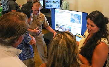 Members of Navy Closure Task Force-Red Hill (NCTF-RH) speak with community members about the reactivation of the Navy Aiea-Halawa Shaft Reactivation during the NCTF-RH open house held at the Oahu Veterans Center in Honolulu, Aug. 20, 2025. The quarterly open house focused on tank cleaning operations, Tank Closure Plan Supplement 4, environmental remediation and monitoring, and reactivation of the Navy Aiea-Halawa Shaft. Charged with the safe decommissioning of the Red Hill Bulk Fuel Storage Facility (RHBFSF), NCTF-RH was established by the Department of the Navy as a commitment to the community and the environment. The Navy continues to engage with the people of Hawaii, regulatory agencies, and other stakeholders as NCTF-RH works to safely and deliberately decommission the RHBFSF. (U.S. Navy photo by Mass Communication Specialist 1st Class Glenn Slaughter)