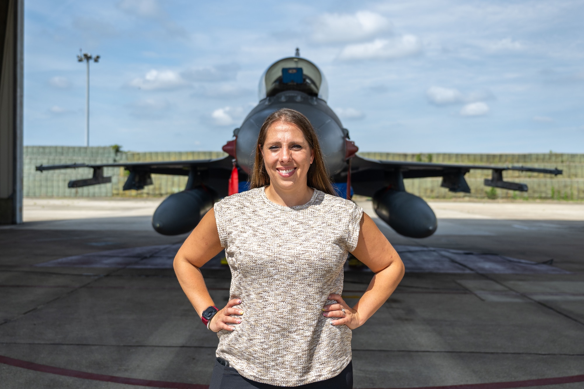Person stand in front of plane.