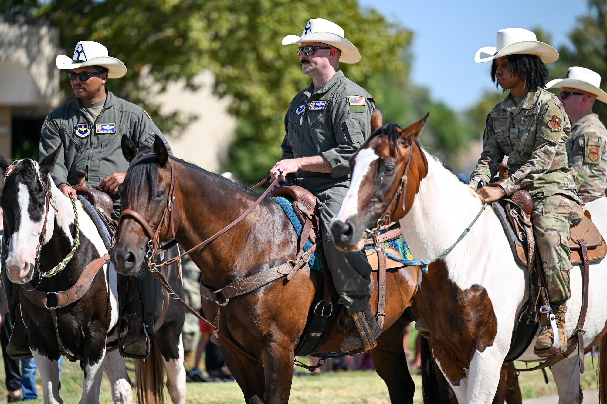 97th Air Mobility Wing leadership ride alongside Senior Airman Khalia McCray, 97th Operations Support Squadron intel operations analyst, in support of the 2025 Cattle Drive at Altus Air Force Base (AFB), Oklahoma, Aug. 21, 2025. McCray was selected as this year’s outstanding Airman at Altus AFB to participate in the Cattle Drive. (U.S. Air Force photo by Airman 1st Class Nathan Langston)