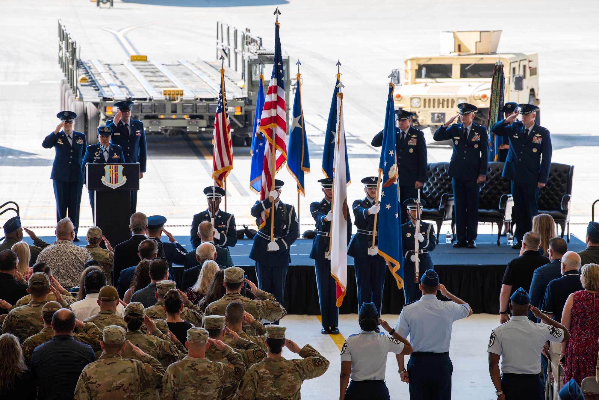 Airmen salute during ceremony