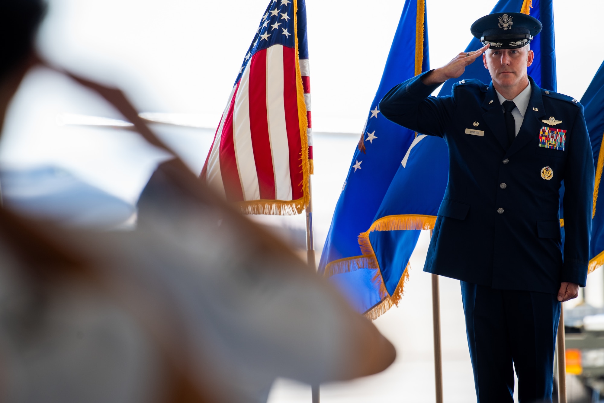 Colonel salutes during ceremony