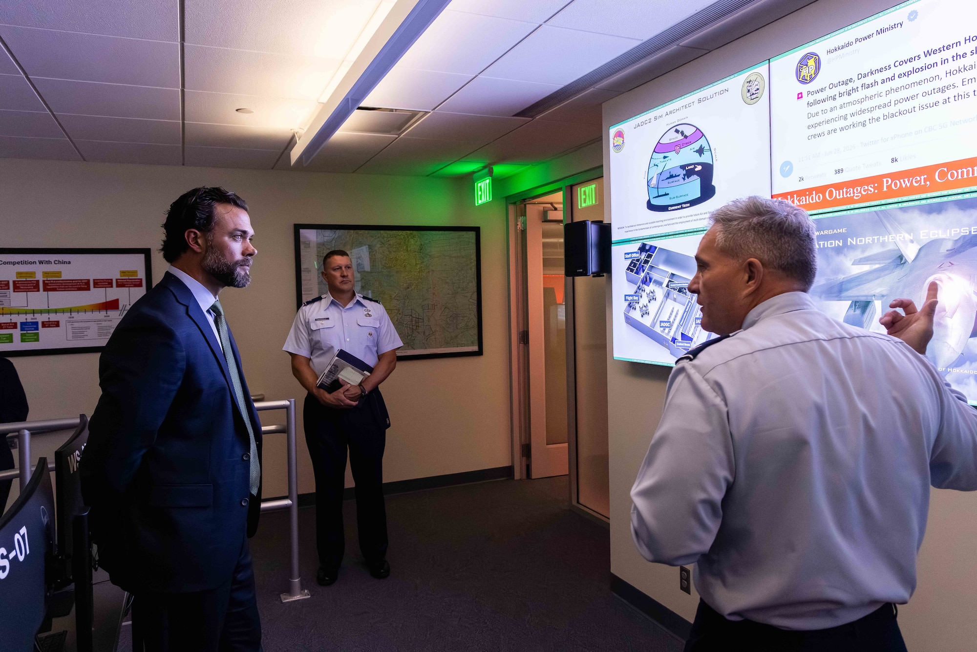 Col. Thomas Swaim, head of the Department of Military and Strategic Studies, briefs Undersecretary of the Air Force Matthew Lohmeier during a tour of the Multi-Domain Laboratory at the U.S. Air Force Academy, Colo., Aug. 19, 2025.
