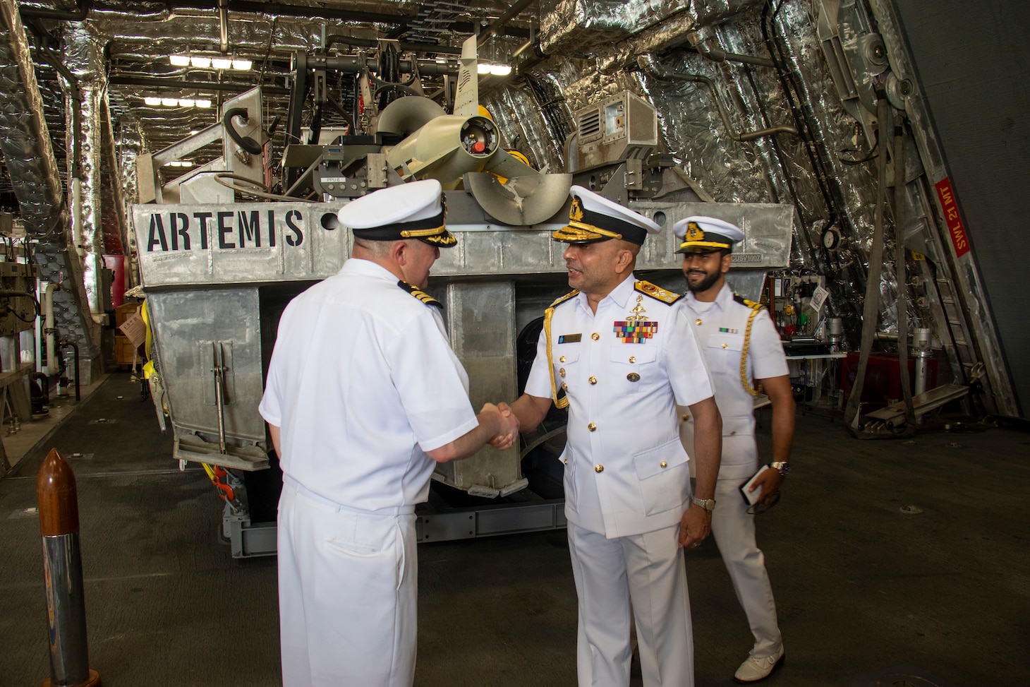 Cmdr. Adam Ochs, commanding officer of the Independence-variant littoral combat ship USS Santa Barbara (LCS 32), shakes hands with Vice Adm. Kanchana Banagoda, Commander of the Sri Lanka Navy, during a tour of the ship, Aug. 16, 2025. Santa Barbara conducted a port visit to Colombo, Sri Lanka while on a rotational deployment to the U.S. 7th Fleet area of operations to strengthen partnerships in the South Asia region. (U.S. Navy photo by Electronics Technician 2nd Class Alexander Klee)