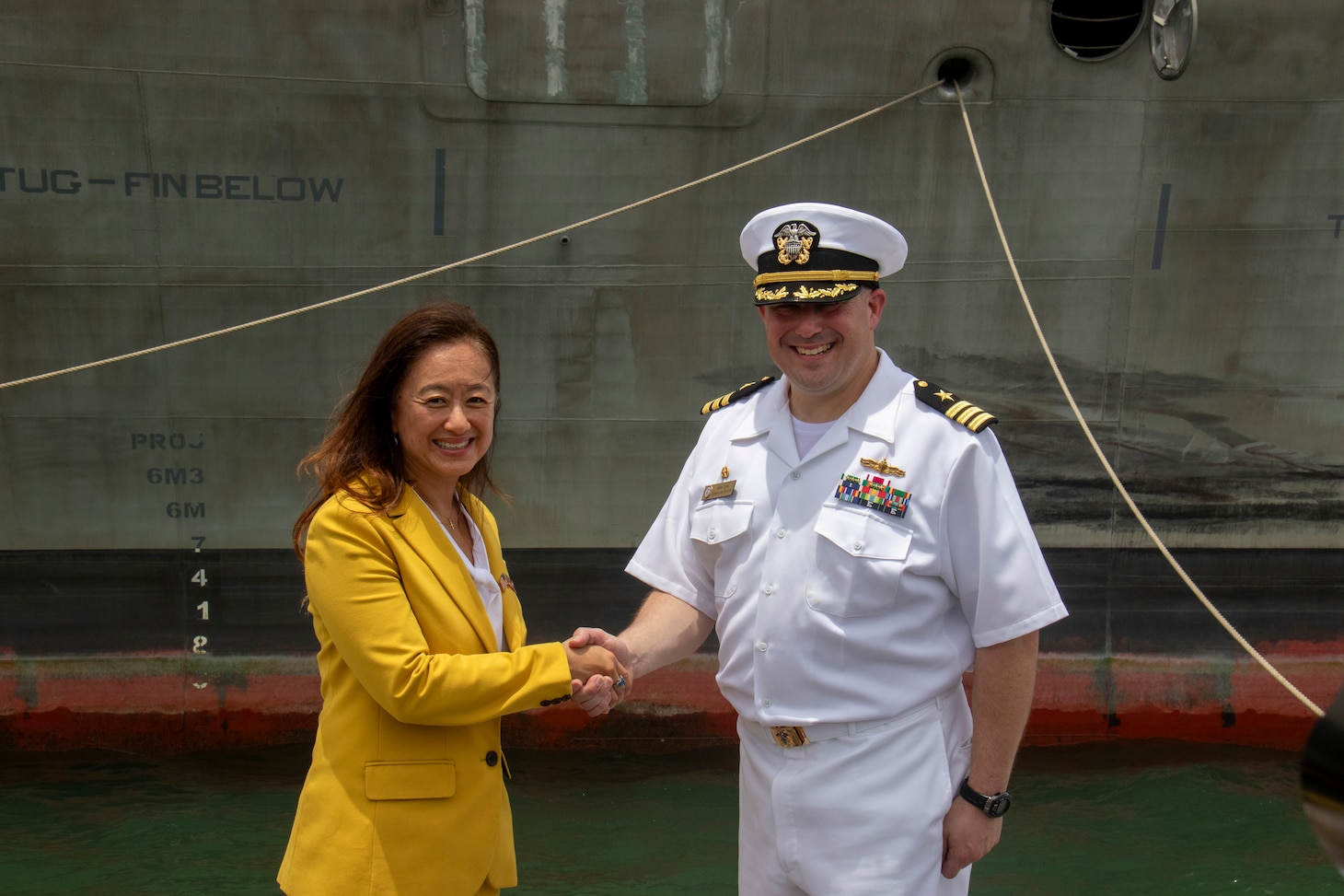 U.S. Ambassador to Sri Lanka Julie Chung shakes hands with Cmdr. Adam Ochs, commanding officer of the Independence-variant littoral combat ship USS Santa Barbara (LCS 32) during a port visit to Colombo, Sir Lanka, Aug. 16, 2025. Santa Barbara conducted a port visit to Colombo, Sri Lanka while on a rotational deployment to the U.S. 7th Fleet area of operations to strengthen partnerships in the South Asia region. (U.S. Navy photo by Electronics Technician 2nd Class Alexander Klee)