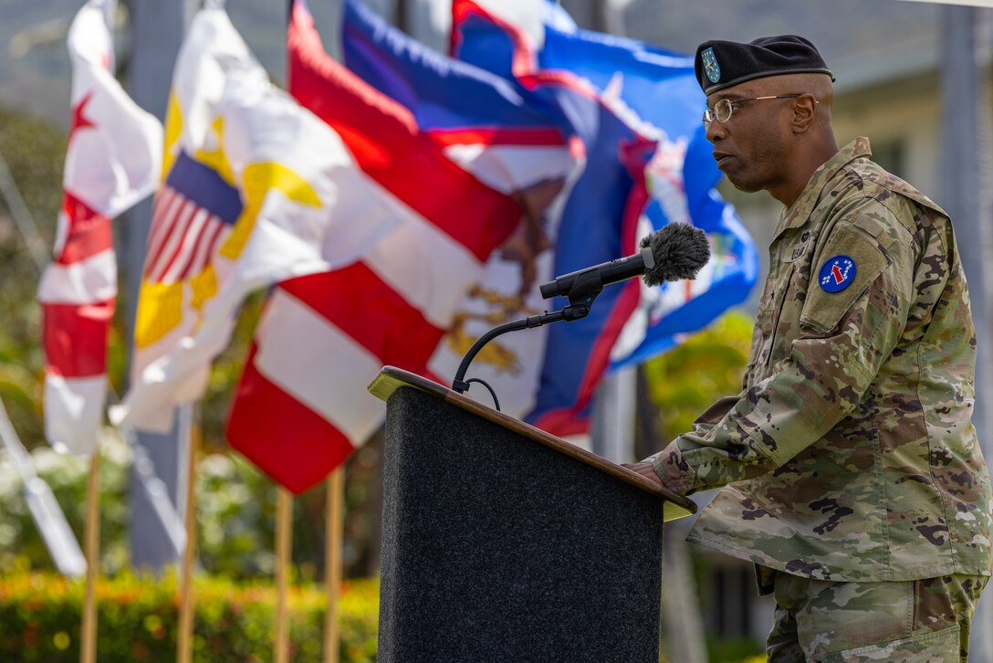 U.S. Army Brig. Gen. George C. Turner, the new U.S. Army Pacific Deputy Commanding General-G3, speaks at a podium during the "Flying V" ceremony at Fort Shafter, Hawaii, on Aug. 22, 2025. The ceremony was held to honor incoming members of the USARPAC team and welcome the incoming G3 and Chief of Staff. (U.S. Army photo by Sgt. Jared Simmons)