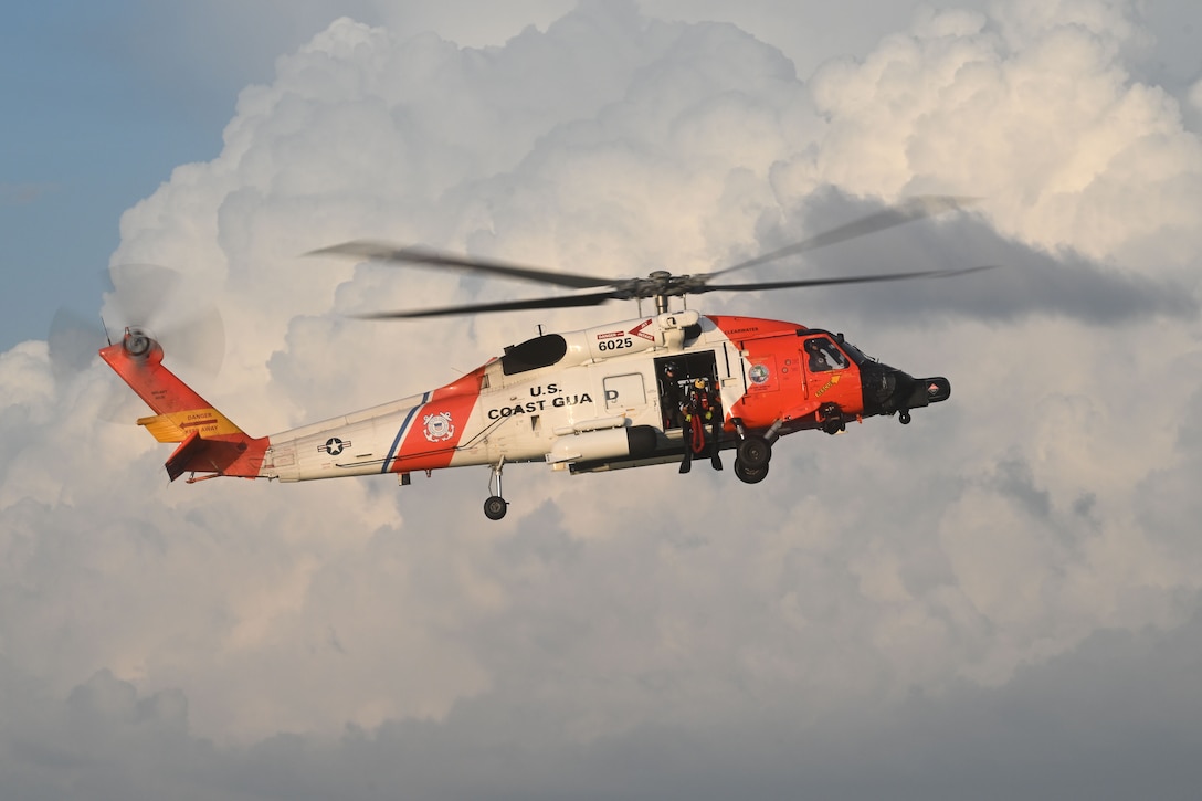 A U.S. Coast Guard Air Station Clearwater MH-60 Jayhawk aircrew prepares to deploy a rescue swimmer during training in Sand Key, Florida, Aug. 13, 2025. U.S. Coast Guard Air Station Clearwater is composed of more than 400 active duty, reserve, Auxiliary and civilian personnel, who provide critical mission support in the Southeast District. (U.S. Coast Guard photo by Petty Officer 1st Class Riley Perkofski)
