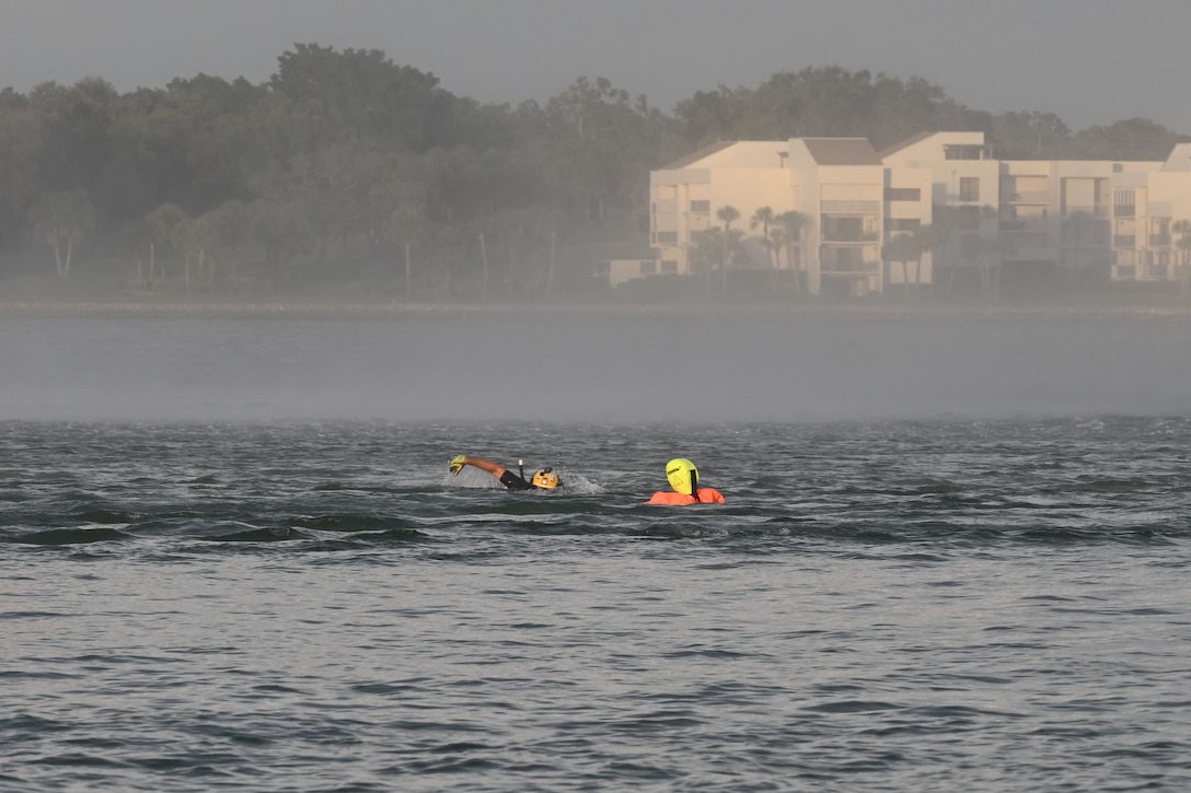 Petty Officer 2nd Class Zachary Loesch, a rescue swimmer assigned to U.S. Coast Guard Air Station Clearwater, swims toward a training dummy during search and rescue training in Sand Key, Florida, Aug. 13, 2025. U.S. Coast Guard Air Station Clearwaters rescue swimmer shop is the largest in the Coast Guard consisting of over 25 active duty aviation survival technicians. (U.S. Coast Guard photo by Petty Officer 1st Class Riley Perkofski)