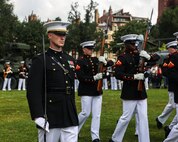 U.S. Marine Corps Capt. Ford Higgins, platoon commander, United States Marine Corps Silent Drill Platoon, Marine Barracks Washington, marches alongside his platoon during a drill sequence at Boston Common in Boston, Aug. 21, 2025. Their performance is part of Marine Week Boston, a community outreach event that brings Marines to cities across the country to showcase their traditions and capabilities. This year also marks the 250th birthday of the United States Marine Corps, a milestone celebrating two and a half centuries of honor, courage and commitment. (U.S. Marine Corps photo by Lance Cpl. Brynn L. Bouchard)