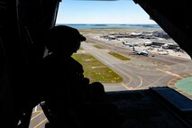 U.S. Marine Corps Sgt. Hannah Burton, a tiltrotor crew chief with Marine Medium Tiltrotor Squadron (VMM-774) assigned to Special Purpose Marine Air-Ground Task Force-250, looks out of the ramp of an MV-22B Osprey at the Signature Aviation Boston Logan International Airport in Boston, Mass., Aug. 22, 2025. The Marine Corps is celebrating its 250th birthday by including activations across the city featuring aircraft, equipment, recruiting opportunities, and public engagements. (U.S. Marine Corps photo by Lance Cpl. Alondra Y. Lopez Gonzalez)