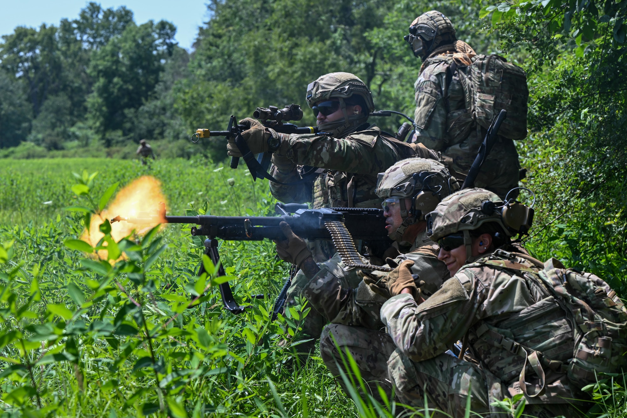 Integrated Defense Leadership Course students fire at opposing forces during an engagement at the Slagle Drop Zone at Camp James A. Garfield Joint Military Training Center, Ohio, during an exercise, July 24, 2025.