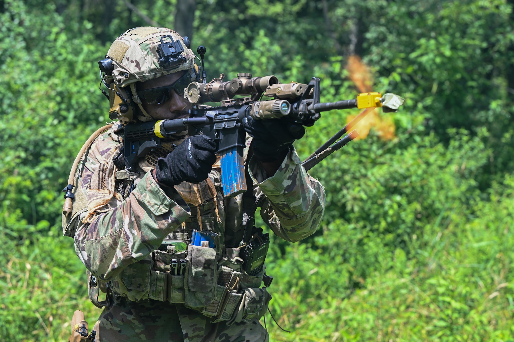 An Integrated Defense Leadership Course student fires at opposing forces during an engagement at the Slagle Drop Zone at Camp James A. Garfield Joint Military Training Center, Ohio, during an exercise, July 24, 2025.