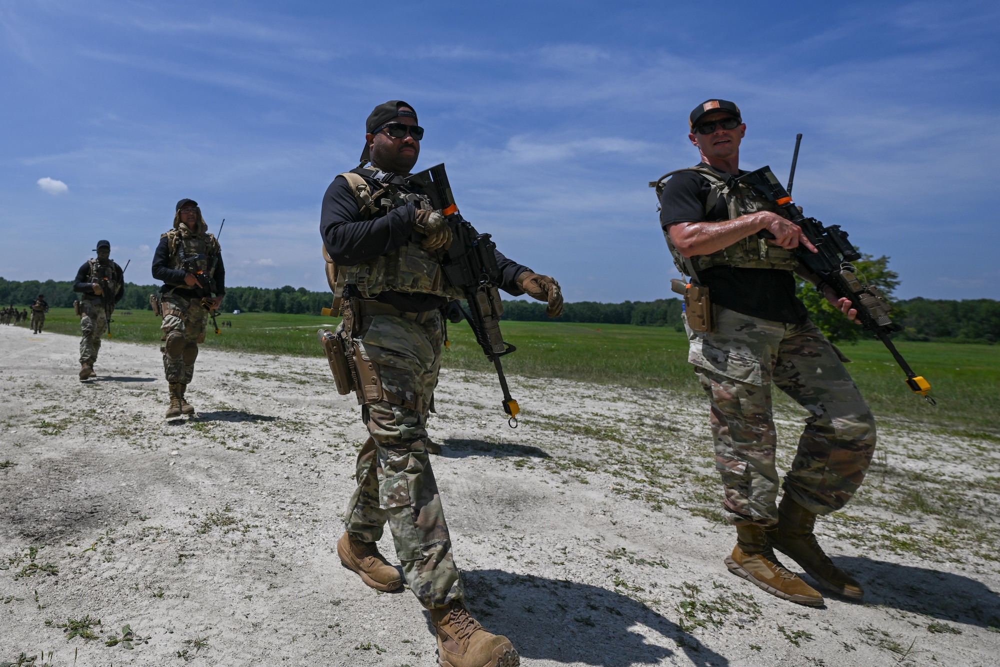 Opposing force students of the Integrated Defense Leadership Course leave the Slagle Drop Zone at Camp James A. Garfield Joint Military Training Center, Ohio, after engaging other forces over a contested airdrop during an exercise, July 24, 2025.