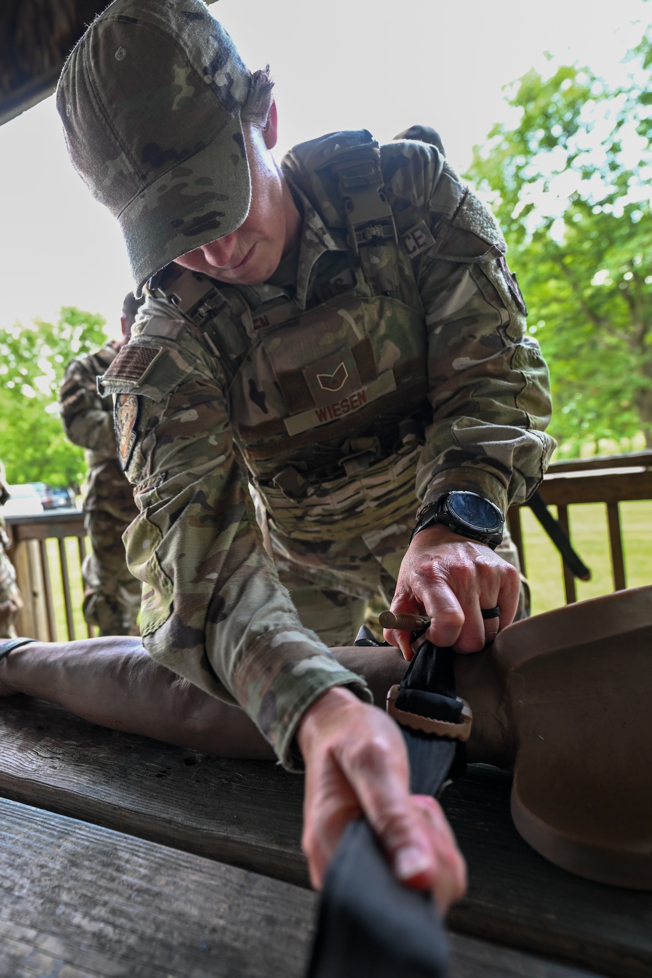 Staff Sgt. Danielle Wiesen, a member of the 910th Aircraft Maintenance Squadron and Integrated Defense Leadership Course student, applies a tourniquet during tactical combat casualty care training at Youngstown Air Reserve Station, Ohio, July 17, 2025.