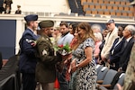 Kathleen Andonie accepts flowers during a combined change of command and retirement ceremony Aug. 9, 2025, at DAR Constitution Hall. Maj. Gen. John C. Andonie, outgoing Commanding General (Interim) of the District of Columbia National Guard, gifted his wife flowers in honor of the support she has provided during his time in service.
