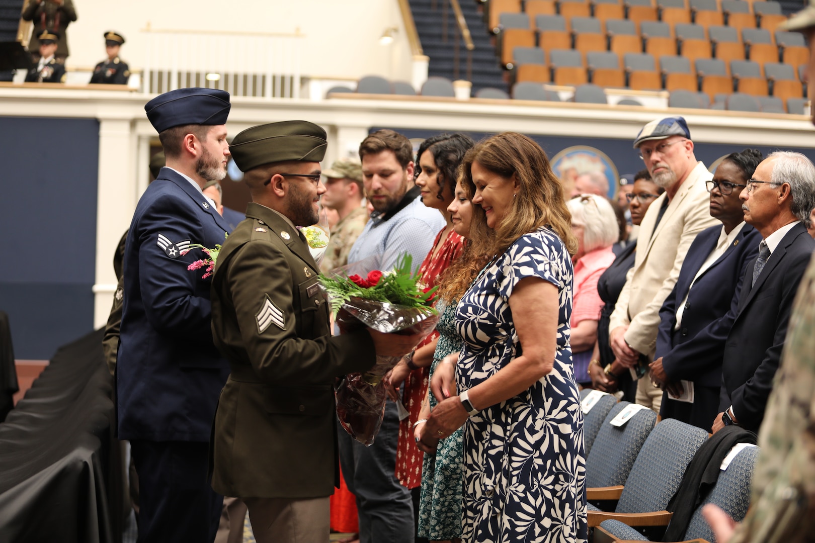 Kathleen Andonie accepts flowers during a combined change of command and retirement ceremony Aug. 9, 2025, at DAR Constitution Hall. Maj. Gen. John C. Andonie, outgoing Commanding General (Interim) of the District of Columbia National Guard, gifted his wife flowers in honor of the support she has provided during his time in service.