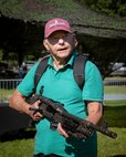 A Boston resident learns about the M240B machine gun at Boston Common during Marine Week Boston, Aug. 22, 2025. Marines display various equipment at the static display showcasing the Marine Corps capabilities to the public. In celebration of 250 years of proud tradition, Marines around the world unite to honor their shared heritage - a legacy defined by honor, courage, and commitment. (U.S. Marine Corps photo by Cpl. Vincent Needham)