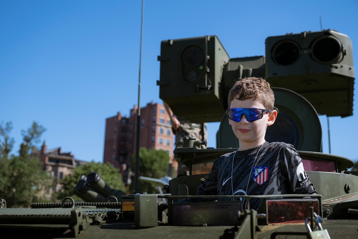 A Boston resident tours the inside of an Light Armored Vehicle-Anti Tank variant at Boston Common during Marine Week Boston, Aug. 22, 2025. Marines set up static displays showcasing the Marine Corps capabilities and equipment to the public. In celebration of 250 years of proud tradition, Marines around the world unite to honor their shared heritage - a legacy defined by honor, courage, and commitment. (U.S. Marine Corps photo by Cpl. Vincent Needham)