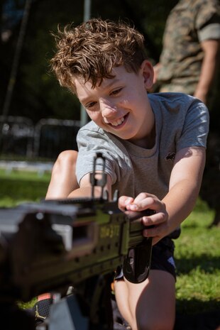 A Boston resident learns about the M240B machine gun at Boston Common during Marine Week Boston, Aug. 22, 2025. Marines display various equipment at the static display showcasing the Marine Corps capabilities to the public. In celebration of 250 years of proud tradition, Marines around the world unite to honor their shared heritage - a legacy defined by honor, courage, and commitment. (U.S. Marine Corps photo by Cpl. Vincent Needham)