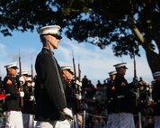 U.S. Marine Corps Capt. Ford Higgins, platoon commander of the United States Marine Corps Silent Drill Platoon, Marine Barracks Washington, marches the platoon during a drill sequence at Marine Week Boston in Marblehead, Massachusetts, Aug. 21, 2025. The year 2025 marks the 250th anniversary of the United States Marine Corps, a milestone that highlights the legacy, transformation and enduring spirit of the Corps since 1775. Throughout the year, Marines across the globe will commemorate this anniversary by honoring the service and sacrifice of those who served before them and by remaining faithful to the motto Semper Fidelis. (U.S. Marine Corps photo by Lance Cpl. Brynn L. Bouchard)
