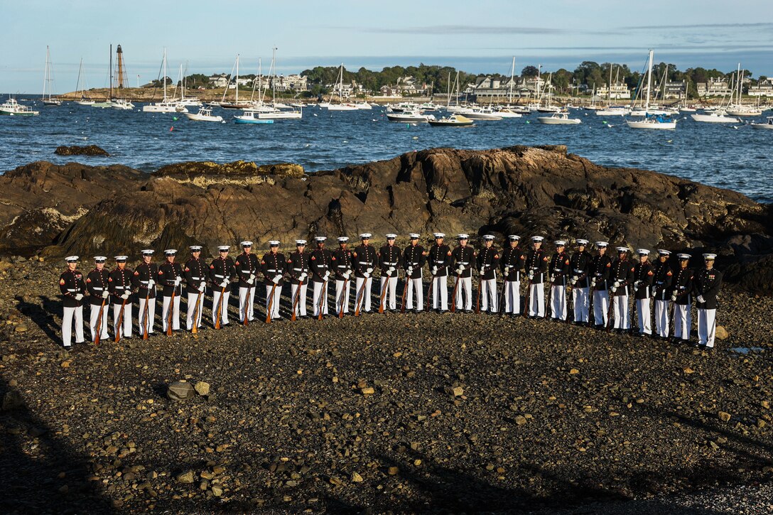 The United States Marine Corps Silent Drill Platoon, representing Marine Barracks Washington, poses for a photo during Marine Week Boston in Marblehead, Massachusetts, Aug. 21, 2025. The year 2025 marks the 250th anniversary of the United States Marine Corps, a milestone that highlights the legacy, transformation and enduring spirit of the Corps since 1775. Throughout the year, Marines across the globe will commemorate this anniversary by honoring the service and sacrifice of those who served before them and by remaining faithful to the motto Semper Fidelis. (U.S. Marine Corps photo by Lance Cpl. Brynn L. Bouchard)