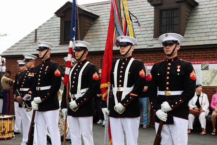 The official United States Marine Corps Color Guard with Marine Barracks Washington prepares to present the colors during the Marblehead welcoming ceremony for Marine Week Boston in Marblehead, Massachusetts, Aug. 21, 2025. The year 2025 marks the 250th anniversary of the United States Marine Corps, a milestone that highlights the legacy, transformation and enduring spirit of the Corps since 1775. Throughout the year, Marines across the globe will commemorate this anniversary by honoring the service and sacrifice of those who served before them and by remaining faithful to the motto Semper Fidelis. (U.S. Marine Corps photo by Lance Cpl. Brynn L. Bouchard)
