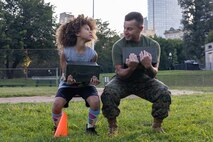 U.S. Marine Corps Sgt. Maj. Efrain Barrientos, right, a native of Princeton, N.J., assigned to Special Purpose Marine Air-Ground Task Force-250, motivates an event attendee during Marine Week Boston, Aug. 23, 2025. Marines stationed across the globe commemorate the 250th anniversary of the Marine Corps, honoring a distinguished legacy of service, sacrifice, and unwavering fidelity to both the nation and fellow Marines. (U.S. Marine Corps photo by blank)