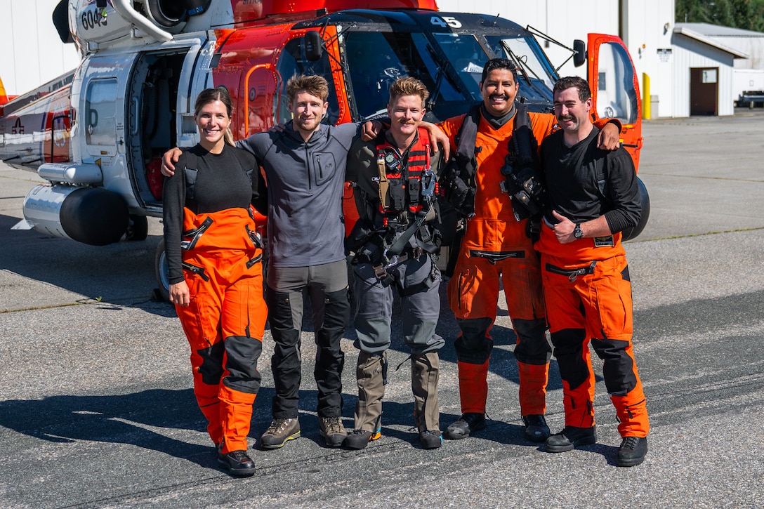 A Coast Guard MH-60 Jayhawk helicopter aircrew from Coast Guard Air Station Sitka poses for a photo in Juneau, Alaska, after rescuing a pilot from a downed aircraft Aug. 24, 2025. The pilot was the only person aboard the downed aircraft and had no reported injuries. (U.S. Coast Guard photo by Chief Petty Officer Travis Magee)