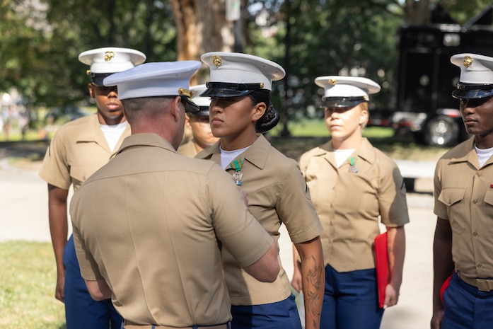 U.S. Marine Corps Lance Cpl. Pena Elizarraraz, a motor vehicle operator assigned to Special Purpose Marine Air-Ground Task Force-250, receives the Navy Achievement Medal at the Soldiers and Sailors Monument during Marine Week Boston, Aug. 24, 2025. Marines and Sailors are awarded a NAM based on performance or achievements within their unit. Marines stationed across the globe commemorate the 250th anniversary of the Marine Corps, honoring a distinguished legacy of service, sacrifice, and unwavering fidelity to both the nation and fellow Marines. (U.S. Marine Corps photo by Cpl. Anakin Smith)