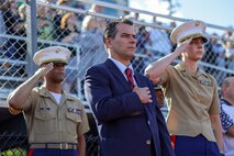 Jared C. Nicholson, center, the mayor of Lynn, Mass., Maj. Courtney Thompson, right, the commanding officer for Recruiting Station Boston, and Capt. Edgardo Diaz, left, the executive officer for RS Boston, stand for the national anthem prior to the RS Boston pool function during Marine Week Boston, Aug. 24, 2025. Pool Functions are held to build camaraderie while preparing future Marines for the mental and physical rigors of recruit training. During Marine Week Boston, Marines with Marine Corps Recruiting Command shared Marine Corps traditions with local high schools in honor of the Corps’ 250th birthday. Marines stationed across the globe commemorate the 250th anniversary of the Marine Corps, honoring a distinguished legacy of service, sacrifice, and unwavering fidelity to both the nation and fellow Marines. (U.S. Marine Corps photo by Sgt. Aidan Hekker)