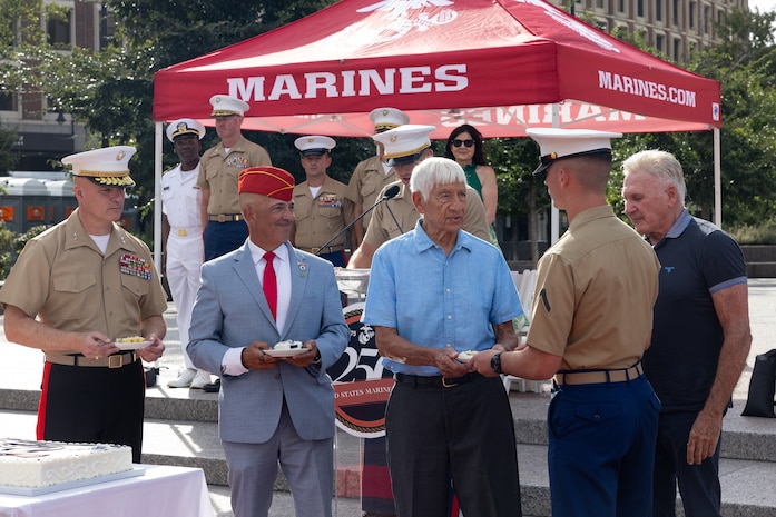 U.S. Marines assigned to Special Purpose Marine Air-Ground Task Force-250 and attendees celebrate the end of Marine Week Boston during a commemoration ceremony at Boston City Hall Plaza, Aug. 24, 2025. Marines stationed across the globe commemorate the 250th anniversary of the Marine Corps, honoring a distinguished legacy of service, sacrifice, and unwavering fidelity to both the nation and fellow Marines. (U.S. Marine Corps photo by Lance Cpl. Orlanys Diaz Figueroa)