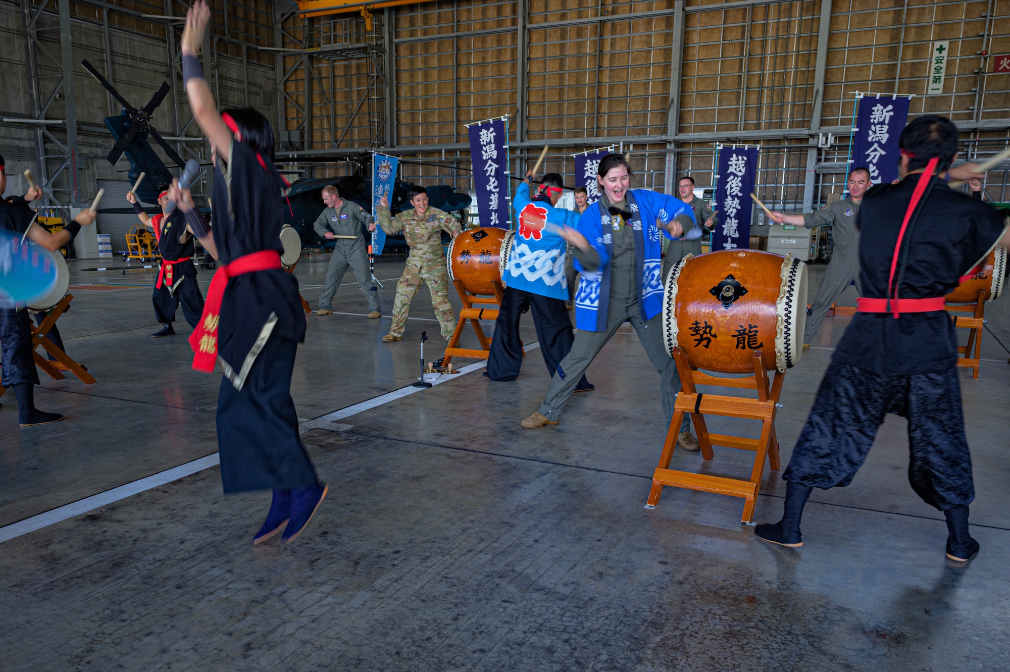 U.S. Air Force members assigned to the 459th Airlift Squadron and Japan Air Self-Defense Force members assigned to the Niigata Air Rescue Squadron practice with traditional Niigata taiko drums before the Niigata festival, Aug. 8, 2025. The 459 AS visited Niigata Air Base to commemorate the units’ long-standing partnership and highlighted the importance of strong bilateral ties and continued cooperation.