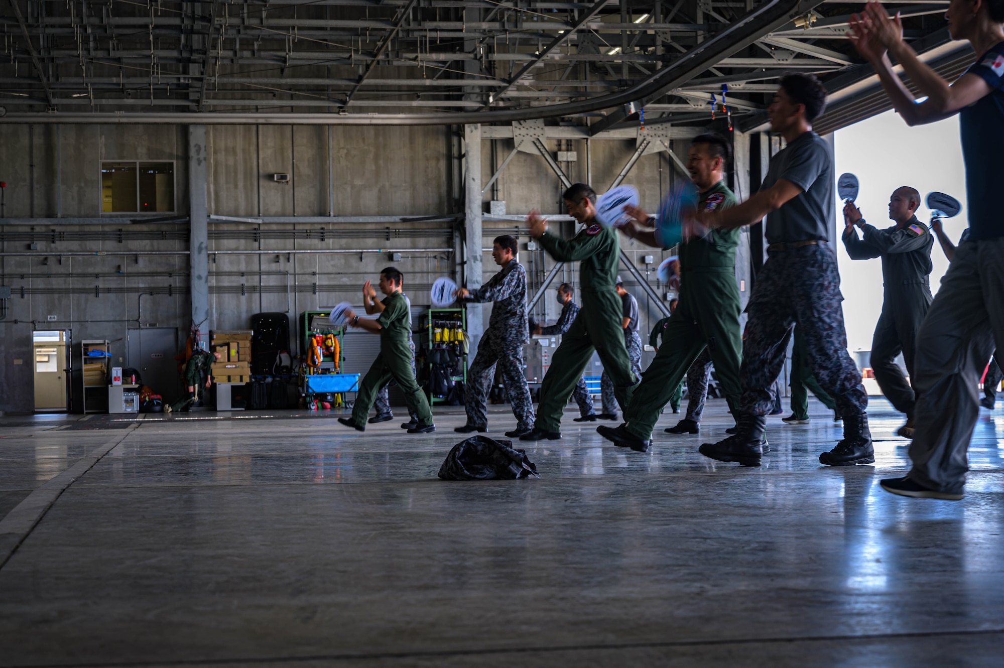U.S. Air Force members assigned to the 459th Airlift Squadron and Japan Air Self-Defense Force members assigned to the Niigata Air Rescue Squadron practice a traditional Niigata dance before the Niigata festival, Aug. 8, 2025. The 459 AS visited Niigata Air Base to commemorate the units’ long-standing partnership and highlighted the importance of strong bilateral ties and continued cooperation.