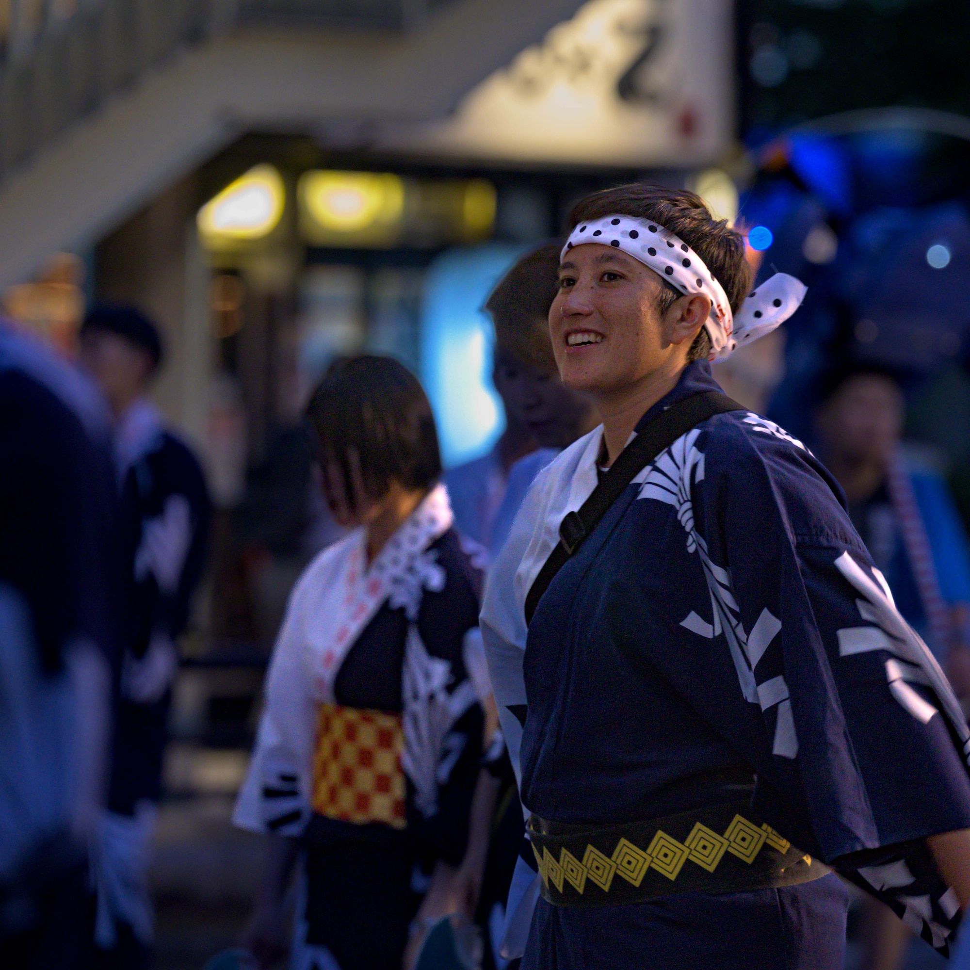 U.S. Air Force Capt. Rachel Curtis, 459th Airlift Squadron C-12 Huron pilot, performs a traditional Niigata dance during the Niigata festival, Aug. 8, 2025. The 459 AS visited Niigata Air Base to commemorate the units’ long-standing partnership and highlight the importance of strong bilateral ties and continued cooperation.