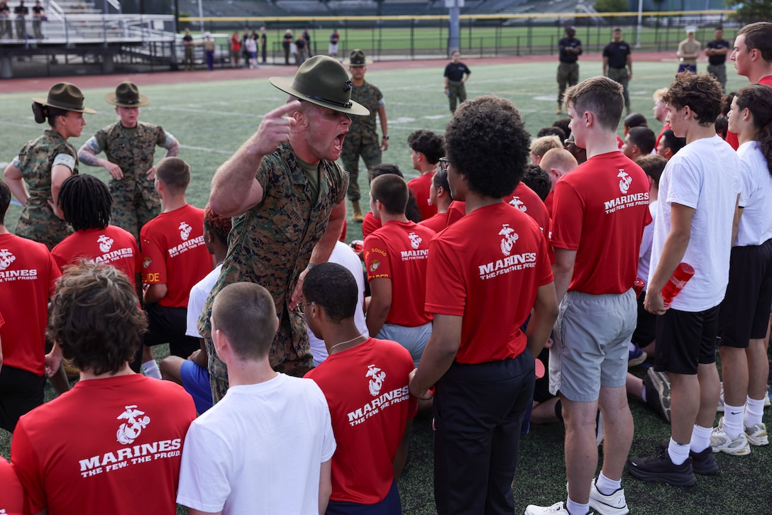 U.S. Marine Corps Staff Sgt. Ean Effert, a drill instructor Golf Company, 2nd Recruit Training Battalion, Marine Corps Recruit Depot Parris Island, motivates poolees with Recruiting Station Boston during Marine Week Boston, Aug. 24, 2025. Pool Functions are held to build camaraderie while preparing future Marines for the mental and physical rigors of recruit training. Marines stationed across the globe commemorate the 250th anniversary of the Marine Corps, honoring a distinguished legacy of service, sacrifice, and unwavering fidelity to both the nation and fellow Marines. (U.S. Marine Corps photo by Sgt. Aidan Hekker)