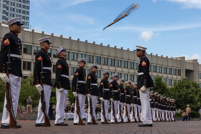 U.S. Marines with the United States Marine Corps Silent Drill Platoon, Marine Barracks Washington, perform in a commemoration ceremony during Marine Week Boston at the Boston City Hall Plaza, Aug. 24, 2025. Marines stationed across the globe commemorate the 250th anniversary of the Marine Corps, honoring a distinguished legacy of service, sacrifice, and unwavering fidelity to both the nation and fellow Marines. (U.S. Marine Corps photo by Lance Cpl. Orlanys Diaz Figueroa)
