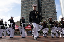 U.S. Marines with the United States Marine Corps Silent Drill Platoon, Marine Barracks Washington, perform in a commemoration ceremony during Marine Week Boston at the Boston City Hall Plaza, Aug. 24, 2025. Marines stationed across the globe commemorate the 250th anniversary of the Marine Corps, honoring a distinguished legacy of service, sacrifice, and unwavering fidelity to both the nation and fellow Marines. (U.S. Marine Corps photo by Lance Cpl. Orlanys Diaz Figueroa)