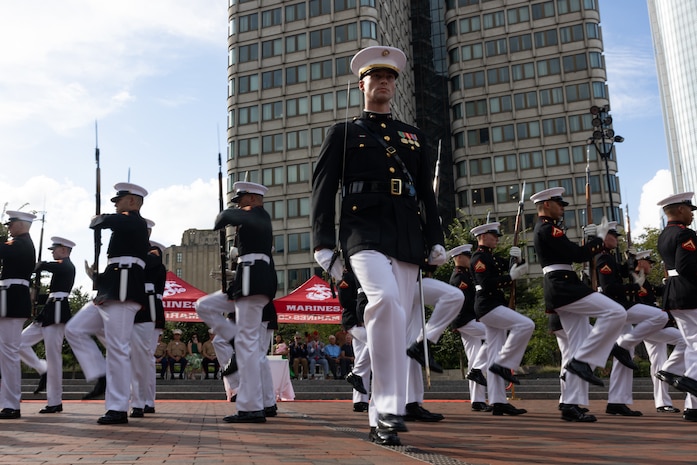 U.S. Marines with the United States Marine Corps Silent Drill Platoon, Marine Barracks Washington, perform in a commemoration ceremony during Marine Week Boston at the Boston City Hall Plaza, Aug. 24, 2025. Marines stationed across the globe commemorate the 250th anniversary of the Marine Corps, honoring a distinguished legacy of service, sacrifice, and unwavering fidelity to both the nation and fellow Marines. (U.S. Marine Corps photo by Lance Cpl. Orlanys Diaz Figueroa)