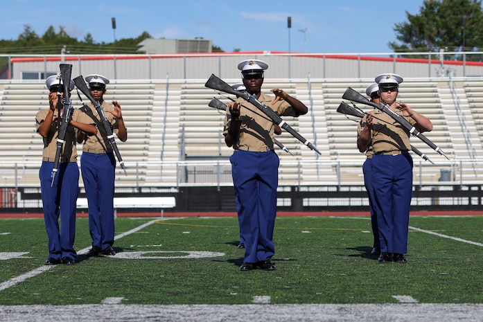 Members of the Lynn English High School Junior Reserve Officer Training Corps drill team perform for Marines, veterans, poolees and guests in celebration of the Marine Corps’ 250th birthday during Marine Week Boston, Aug. 24, 2025. Marines with Marine Corps Recruiting Command share their traditions with local high schools in honor of the Corps’ 250th birthday. In celebration of 250 years of proud tradition, Marines around the world unite to honor their shared heritage - a legacy defined by honor, courage, and commitment. (U.S. Marine Corps photo by Sgt. Aidan Hekker)