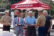 U.S. Marines assigned to Special Purpose Marine Air-Ground Task Force-250 and attendees celebrate the end of Marine Week Boston during a commemoration ceremony at Boston City Hall Plaza, Aug. 24, 2025. Marines stationed across the globe commemorate the 250th anniversary of the Marine Corps, honoring a distinguished legacy of service, sacrifice, and unwavering fidelity to both the nation and fellow Marines. (U.S. Marine Corps photo by Lance Cpl. Orlanys Diaz Figueroa)