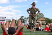 U.S. Marine Corps Sgt. Shannon Ruddy, a drill instructor with Mike Company, 3rd Recruit Training Battalion, Marine Corps Recruit Depot Parris Island, directs poolees with Recruiting Station Boston during Marine Week Boston, Aug. 24, 2025. Pool Functions are held to build camaraderie while preparing future Marines for the mental and physical rigors of recruit training. Marines stationed across the globe commemorate the 250th anniversary of the Marine Corps, honoring a distinguished legacy of service, sacrifice, and unwavering fidelity to both the nation and fellow Marines. (U.S. Marine Corps photo by Sgt. Aidan Hekker)