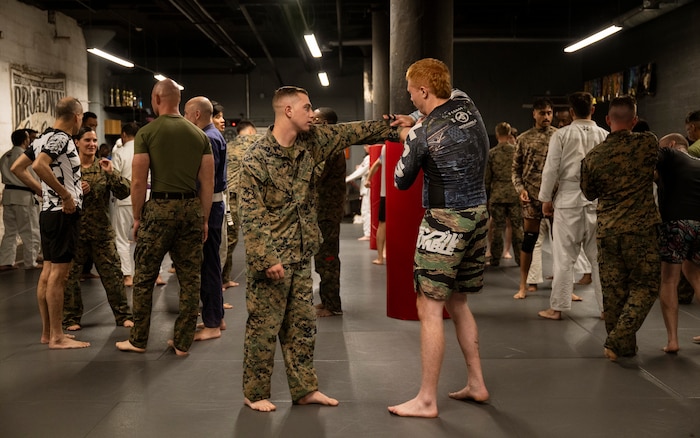 U.S. Marines assigned to Special Purpose Marine Air-Ground Task Force-250 attend a martial arts collaboration at Broadway Jiu-Jitsu during Marine Week Boston, Aug. 22, 2025. Marines stationed across the globe commemorate the 250th anniversary of the Marine Corps, honoring a distinguished legacy of service, sacrifice, and unwavering fidelity to both the nation and fellow Marines. (U.S. Marine Corps photo by Cpl. Vincent Needham)