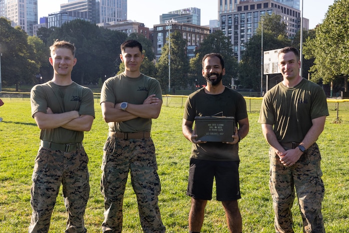 U.S. Marines assigned to Special Purpose Marine Air-Ground Task Force-250 and an event attendee pose for a photo during Marine Week Boston, Aug. 23, 2025. Marines stationed across the globe commemorate the 250th anniversary of the Marine Corps, honoring a distinguished legacy of service, sacrifice, and unwavering fidelity to both the nation and fellow Marines. (U.S. Marine Corps photo by Lance Cpl. Orlanys Diaz Figueroa)